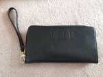 Brand New in box. ELLE black RFID long wallet purse wristlet  Cdn $60  Lot of compartments for credit cards and bills and coins  Anti thief RFID.  Great for travelling
