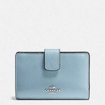 Brand New Coash Light Blue Small Medium Wallet  MEDIUM CORNER ZIP WALLET IN CROSSGRAIN LEATHER (COACH F54010)  Details Crossgrain leather Six credit card slots Bill compartments ID window Zip-around and snap closures 6 1/4" (L) x 4" (H)  COACH MSRP:$165 NOW CDN $120