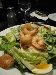 caesar salad, poached egg and grilled prawn