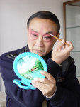 Kun Opera actor doing his own make up