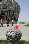 Elmo and three ppl with red caps