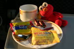 Elmo enjoying snacks in first class train!